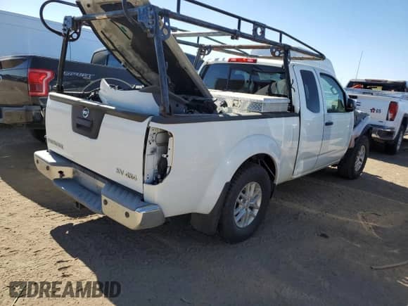 2015 Nissan Frontier SV with VIN 1N6AD0CW7FN736757, listed as a Copart auction lot 74289654 with 142,194 mi miles and Salvage title. Bid and sale history available at DreamBid. Image 3.