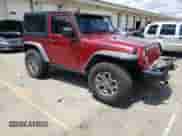 2013 Jeep Wrangler Rubicon 10th Anniversary with VIN 1C4BJWCG6DL508396, listed as a Copart auction lot 61451255 with 125,138 mi miles and Salvage title. Bid and sale history available at DreamBid. Image 4.
