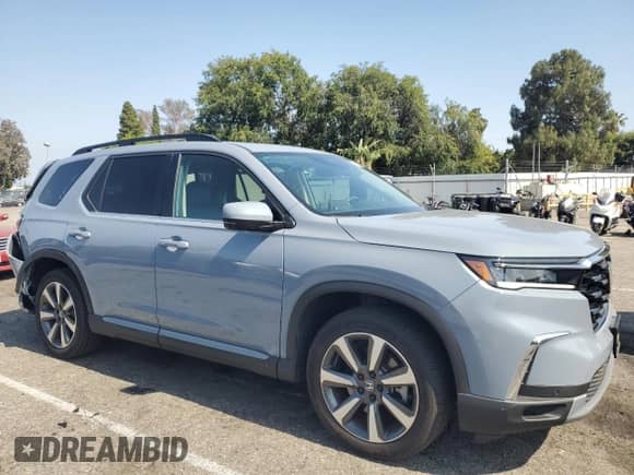 2024 Honda Pilot Touring с VIN 5FNYG2H70RB015527, выставлен на аукционе Copart как лот 59353985 с пробегом 21 461 миль миль и Списание • Salvage title. История ставок и продаж доступна на DreamBid. Изображение 4.