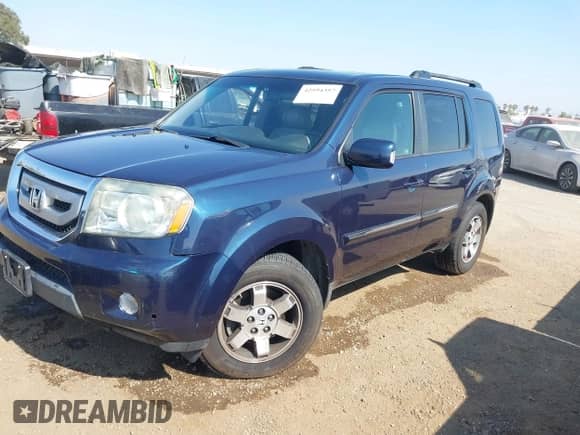 2009 Honda Pilot Touring with VIN 5FNYF38839B003759, listed as a IAAI auction lot 42594357 with 208,297 mi miles and . Bid and sale history available at DreamBid. Image 2.