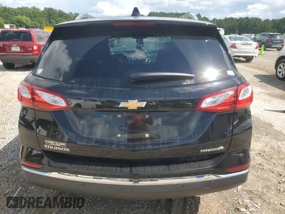 2019 Chevrolet Equinox Premier with VIN 3GNAXNEV9KL209297, listed as a Copart auction lot 64791585 with 105,810 mi miles and Salvage title. Bid and sale history available at DreamBid. Image 6.
