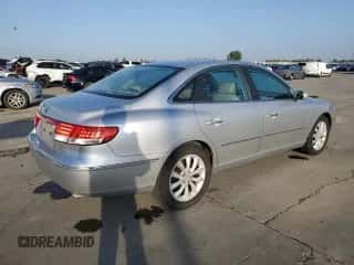 2007 Hyundai Azera SE z VIN KMHFC46F67A179939, wystawiony jako Copart lot #82668965 z przebiegiem 213 551 mil mil oraz Szkoda całkowita • Salvage title. Historia ofert i sprzedaży dostępna na DreamBid. Obrazek 3.