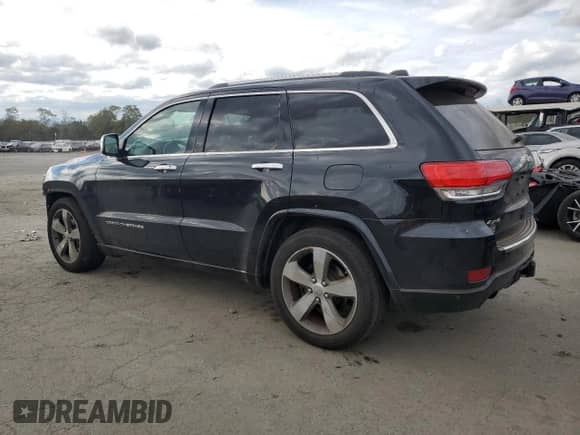 2016 Jeep Grand Cherokee Overland with VIN 1C4RJFCG6GC489769, listed as a Copart auction lot 82302855 with 136,225 mi miles and Salvage title. Bid and sale history available at DreamBid. Image 2.