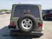 2003 Jeep Wrangler Sahara с VIN 1J4FA59S53P304486, выставлен на аукционе Copart как лот 63196275 с пробегом Не указан миль и Списание • Salvage title. История ставок и продаж доступна на DreamBid. Изображение 6.