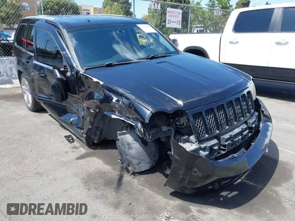 2009 Jeep Grand Cherokee with VIN 1J8HR78W89C520526, listed as a IAAI auction lot 43193483 with 102,738 mi miles and . Bid and sale history available at DreamBid. Image 1.