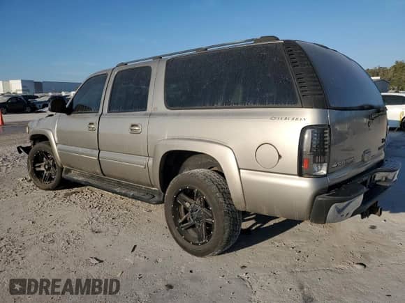 2003 Chevrolet Suburban LT with VIN 3GNEC16Z53G134051, listed as a Copart auction lot 76923234 with Not provided miles and Salvage title. Bid and sale history available at DreamBid. Image 2.