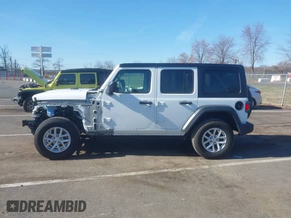 2023 Jeep Wrangler Sport S z VIN 1C4HJXDN4PW702277, wystawiony jako IAAI lot #41835864 z przebiegiem 27 768 mil mil oraz . Historia ofert i sprzedaży dostępna na DreamBid. Obrazek 14.