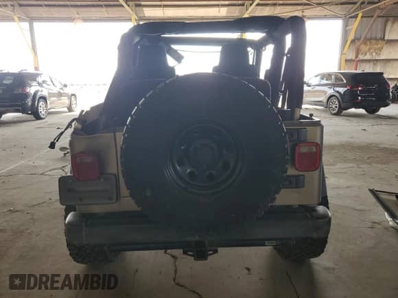 2004 Jeep Wrangler Sport z VIN 1J4FA49S14P768676, wystawiony jako Copart lot #69976745 z przebiegiem 165 894 mil mil oraz Szkoda całkowita • Salvage title. Historia ofert i sprzedaży dostępna na DreamBid. Obrazek 6.