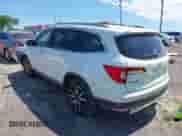 2020 Honda Pilot Touring 7-Passenger z VIN 5FNYF5H69LB000835, wystawiony jako IAAI lot #42318516 z przebiegiem 122 572 mil mil oraz . Historia ofert i sprzedaży dostępna na DreamBid. Obrazek 3.