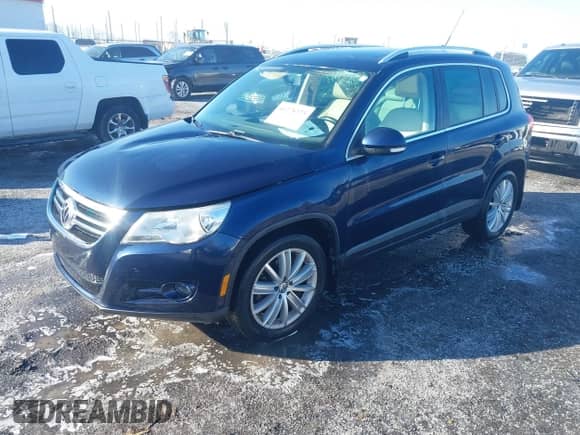 2011 Volkswagen Tiguan SE with VIN WVGAV7AX6BW526154, listed as a IAAI auction lot 41278373 with 162,851 mi miles and . Bid and sale history available at DreamBid. Image 20.
