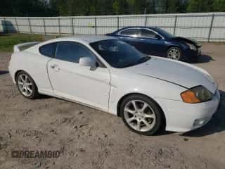 2004 Hyundai Tiburon GT с VIN KMHHN65F84U149299, выставлен на аукционе Copart как лот 73946344 с пробегом 186 198 миль миль и На запчасти • Non repairable. История ставок и продаж доступна на DreamBid. Изображение 4.