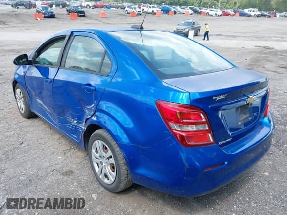 2017 Chevrolet Sonic LS with VIN 1G1JB5SH6H4143448, listed as a IAAI auction lot 43099347 with 89,763 mi miles and . Bid and sale history available at DreamBid. Image 3.