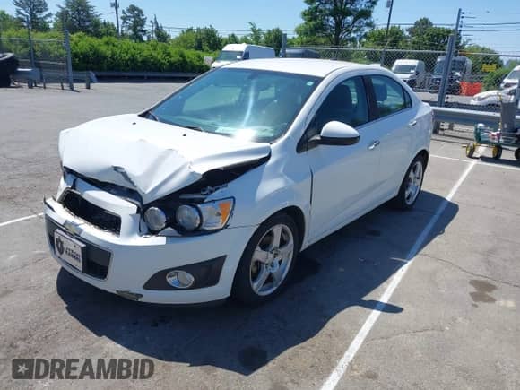 2014 Chevrolet Sonic LTZ with VIN 1G1JE5SH9E4113444, listed as a IAAI auction lot 42144901 with 137,568 mi miles and . Bid and sale history available at DreamBid. Image 2.