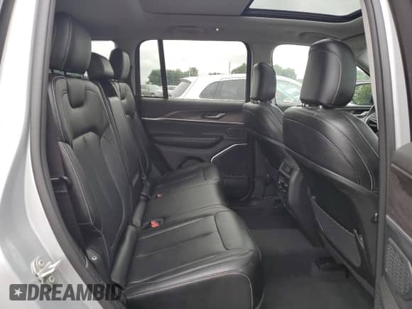 2023 Jeep Grand Cherokee with VIN 1C4RJYB64PC649720, listed as a Copart auction lot 84032325 with 59,572 mi miles and Clean title. Bid and sale history available at DreamBid. Image 11.