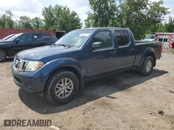 2015 Nissan Frontier SL with VIN 1N6AD0FV3FN732479, listed as a Copart auction lot 64464515 with 117,390 mi miles and Salvage title. Bid and sale history available at DreamBid. Image 1.