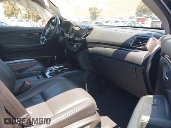 2022 Honda Pilot Touring 8-Passenger with VIN 5FNYF5H94NB004420, listed as a IAAI auction lot 42223140 with 43,210 mi miles and . Bid and sale history available at DreamBid. Image 5.