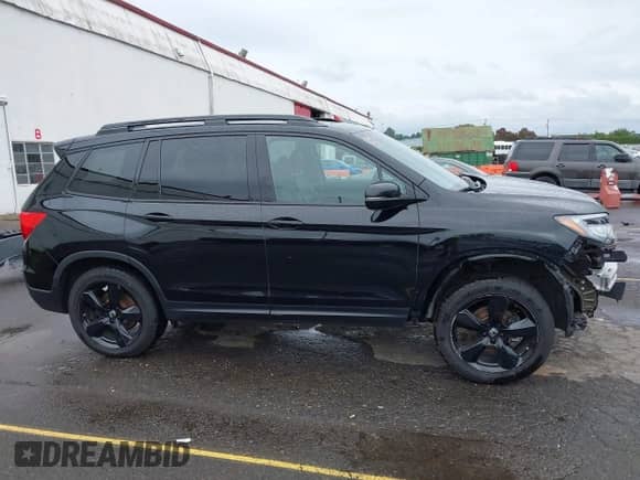 2021 Honda Passport Elite z VIN 5FNYF8H07MB012125, wystawiony jako IAAI lot #43334166 z przebiegiem 40 204 mil mil oraz . Historia ofert i sprzedaży dostępna na DreamBid. Obrazek 14.