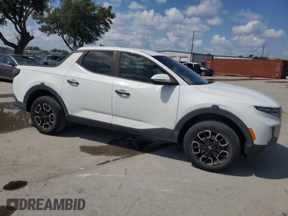 2022 Hyundai Santa Cruz SEL с VIN 5NTJB4AE1NH009303, выставлен на аукционе Copart как лот 69739335 с пробегом 48 774 миль миль и На запчасти • Non repairable. История ставок и продаж доступна на DreamBid. Изображение 4.