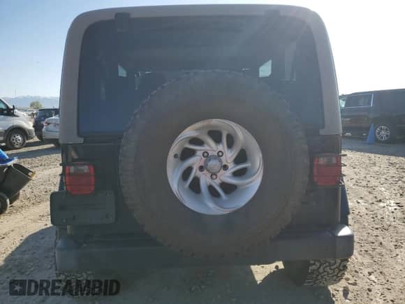 1999 Jeep Wrangler Sahara with VIN 1J4FY49S9XP479545, listed as a Copart auction lot 54753745 with 34,642 mi miles and Salvage title. Bid and sale history available at DreamBid. Image 6.