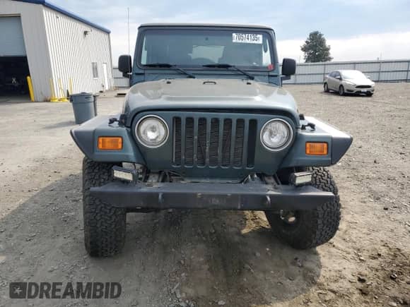 2003 Jeep Wrangler Rubicon с VIN 1J4FA69S43P327618, выставлен на аукционе Copart как лот 70574135 с пробегом 111 917 миль миль и Списание • Salvage title. История ставок и продаж доступна на DreamBid. Изображение 5.