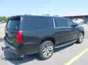 2019 Chevrolet Suburban Premier with VIN 1GNSCJKC5KR304766, listed as a IAAI auction lot 42410264 with 105,171 mi miles and . Bid and sale history available at DreamBid. Image 4.