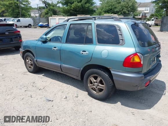 2003 Hyundai Santa Fe GLS with VIN KM8SC73DX3U476918, listed as a IAAI auction lot 42856334 with 214,751 mi miles and . Bid and sale history available at DreamBid. Image 3.