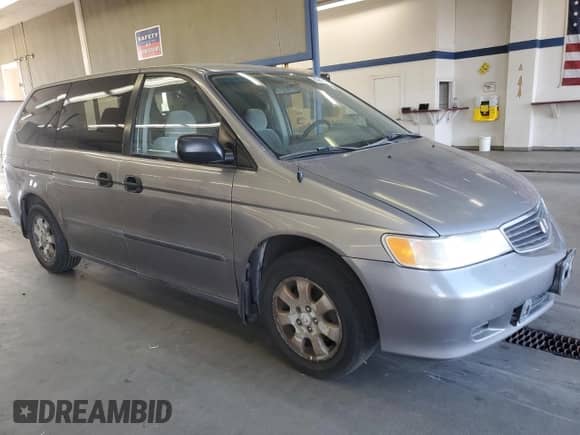 1999 Honda Odyssey LX with VIN 2HKRL1850XH503979, listed as a Copart auction lot 80888115 with 269,275 mi miles and Clean title. Bid and sale history available at DreamBid. Image 4.