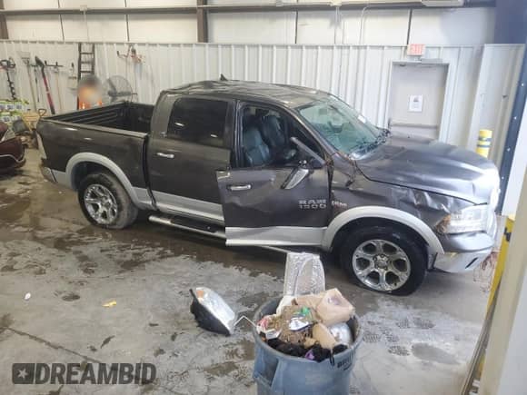 2014 Ram 1500 Laramie with VIN 1C6RR7NT5ES375183, listed as a Copart auction lot 85163365 with 149,376 mi miles and Salvage title. Bid and sale history available at DreamBid. Image 4.