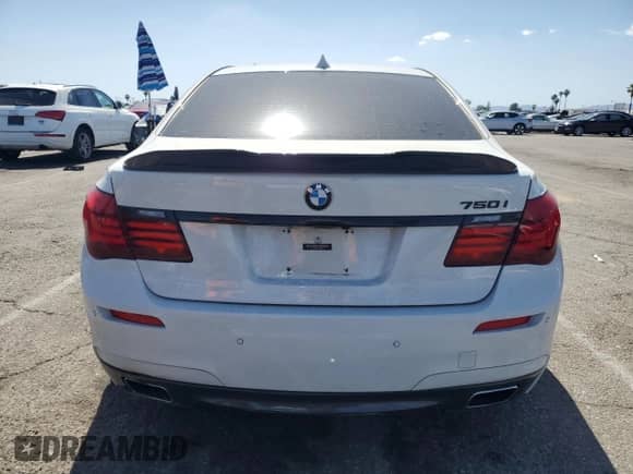 2013 BMW 7 Series 750i with VIN WBAYA8C54DC996412, listed as a Copart auction lot 56982895 with 124,258 mi miles and Salvage title. Bid and sale history available at DreamBid. Image 6.