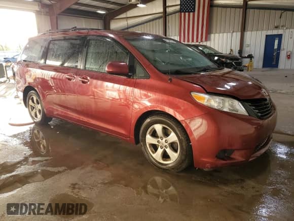 2014 Toyota Sienna LE with VIN 5TDKK3DC6ES518093, listed as a Copart auction lot 85151965 with 104,918 mi miles and Salvage title. Bid and sale history available at DreamBid. Image 4.