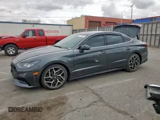 2022 Hyundai Sonata N Line с VIN KMHL14JC2NA217721, выставлен на аукционе Copart как лот 63188725 с пробегом 18 797 миль миль и Списание • Salvage title. История ставок и продаж доступна на DreamBid. Изображение 1.