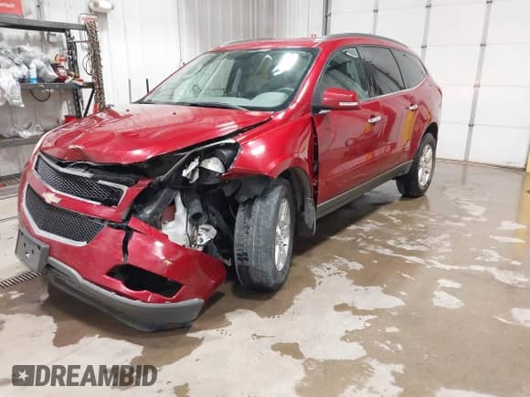 2012 Chevrolet Traverse 2LT with VIN 1GNKVJED7CJ226425, listed as a IAAI auction lot 42531601 with 208,586 mi miles and . Bid and sale history available at DreamBid. Image 2.