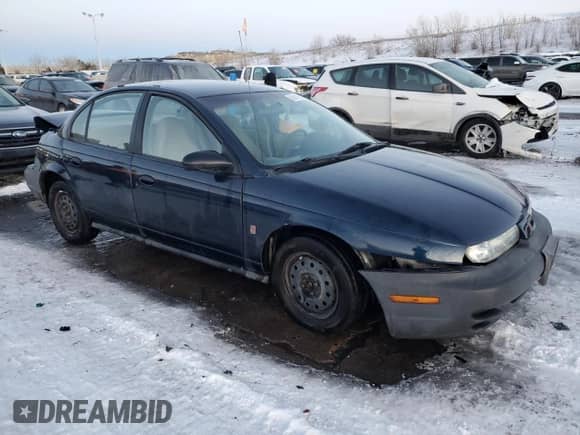 1999 Saturn SL с VIN 1G8ZF528XXZ164152, выставлен на аукционе Copart как лот 88041905 с пробегом 175 709 миль миль и Списание • Salvage title. История ставок и продаж доступна на DreamBid. Изображение 4.