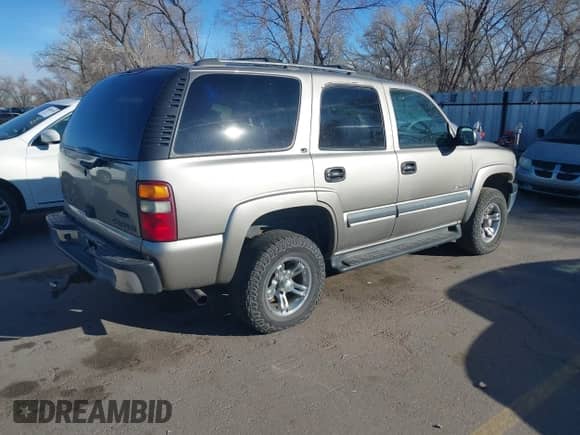 2002 Chevrolet Tahoe Z71 z VIN 1GNEK13Z32R125421, wystawiony jako IAAI lot #41859011 z przebiegiem 216 021 mil mil oraz . Historia ofert i sprzedaży dostępna na DreamBid. Obrazek 4.