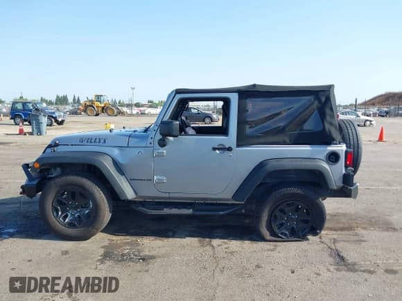 2015 Jeep Wrangler Sport with VIN 1C4AJWAG0FL773008, listed as a IAAI auction lot 42422112 with 88,370 mi miles and . Bid and sale history available at DreamBid. Image 14.
