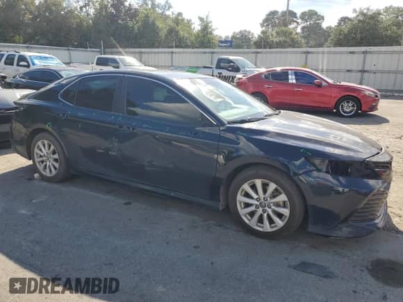 2019 Toyota Camry LE с VIN 4T1B11HK6KU842124, выставлен на аукционе Copart как лот 83793575 с пробегом 194 095 миль миль и Списание • Salvage title. История ставок и продаж доступна на DreamBid. Изображение 4.