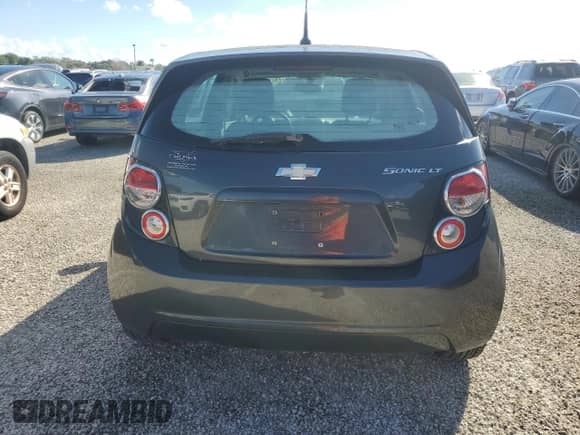2014 Chevrolet Sonic LT z VIN 1G1JD6SH2E4142678, wystawiony jako Copart lot #74555124 z przebiegiem Nie podano mil oraz Szkoda całkowita • Salvage title. Historia ofert i sprzedaży dostępna na DreamBid. Obrazek 6.