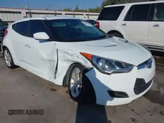 2013 Hyundai Veloster w/Gray Int with VIN KMHTC6AD3DU092515, listed as a IAAI auction lot 43308569 with 141,807 mi miles and . Bid and sale history available at DreamBid. Image 1.