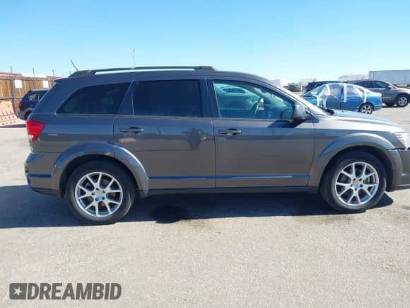 2014 Dodge Journey SXT with VIN 3C4PDDBG8ET214636, listed as a IAAI auction lot 41651140 with 141,742 mi miles and . Bid and sale history available at DreamBid. Image 13.