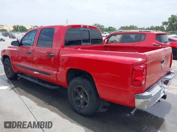 2005 Dodge Dakota SLT with VIN 1D7HE48N65S209630, listed as a IAAI auction lot 42409822 with 224,849 mi miles and . Bid and sale history available at DreamBid. Image 3.