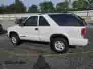 2000 Chevrolet Blazer LS z VIN 1GNCT18W7YK250829, wystawiony jako Copart lot #60228025 z przebiegiem 174 005 mil mil oraz Szkoda całkowita • Salvage title. Historia ofert i sprzedaży dostępna na DreamBid. Obrazek 2.