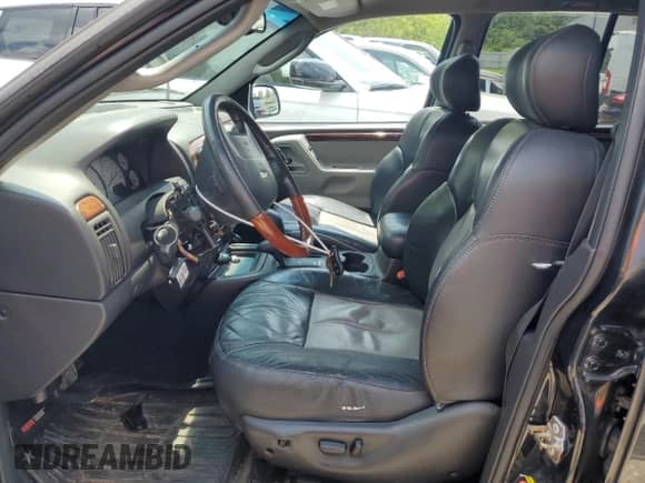 2004 Jeep Grand Cherokee Overland с VIN 1J8GW68J54C217103, выставлен на аукционе Copart как лот 62670434 с пробегом Не указан миль и Списание • Salvage title. История ставок и продаж доступна на DreamBid. Изображение 7.