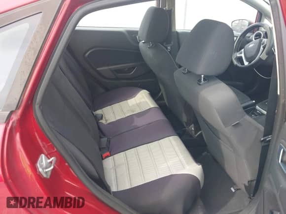 2014 Ford Fiesta SE z VIN 3FADP4BJXEM132171, wystawiony jako IAAI lot #42910603 z przebiegiem 159 580 mil mil oraz . Historia ofert i sprzedaży dostępna na DreamBid. Obrazek 8.