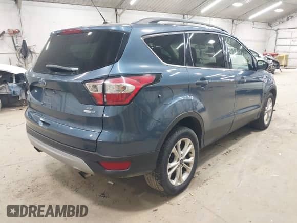2018 Ford Escape SE with VIN 1FMCU9GD8JUB66187, listed as a IAAI auction lot 43298016 with 76,985 mi miles and . Bid and sale history available at DreamBid. Image 4.