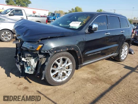 2014 Jeep Grand Cherokee Summit with VIN 1C4RJFJT4EC154815, listed as a IAAI auction lot 43209009 with 59,122 mi miles and . Bid and sale history available at DreamBid. Image 18.