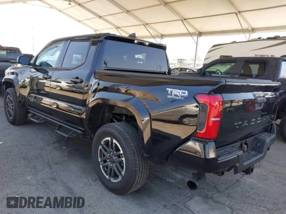 2025 Toyota Tacoma SR5 with VIN 3TMKB5FN5SM034762, listed as a IAAI auction lot 42217544 with 1,127 mi miles and . Bid and sale history available at DreamBid. Image 3.