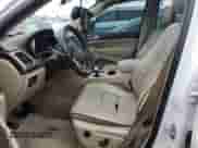 2015 Jeep Grand Cherokee Overland with VIN 1C4RJECG5FC635328, listed as a Copart auction lot 50740185 with 187,041 mi miles and Salvage title. Bid and sale history available at DreamBid. Image 7.