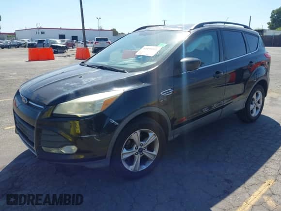 2014 Ford Escape SE with VIN 1FMCU0GX8EUE40872, listed as a IAAI auction lot 43359211 with 146,863 mi miles and . Bid and sale history available at DreamBid. Image 17.