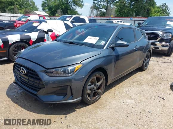 2019 Hyundai Veloster 2.0 z VIN KMHTG6AFXKU016745, wystawiony jako IAAI lot #42137343 z przebiegiem 90 095 mil mil oraz . Historia ofert i sprzedaży dostępna na DreamBid. Obrazek 2.
