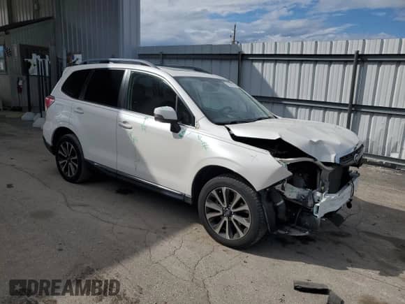 2017 Subaru Forester Touring z VIN JF2SJGWCXHH453105, wystawiony jako Copart lot #70501345 z przebiegiem 146 190 mil mil oraz Szkoda całkowita • Salvage title. Historia ofert i sprzedaży dostępna na DreamBid. Obrazek 4.